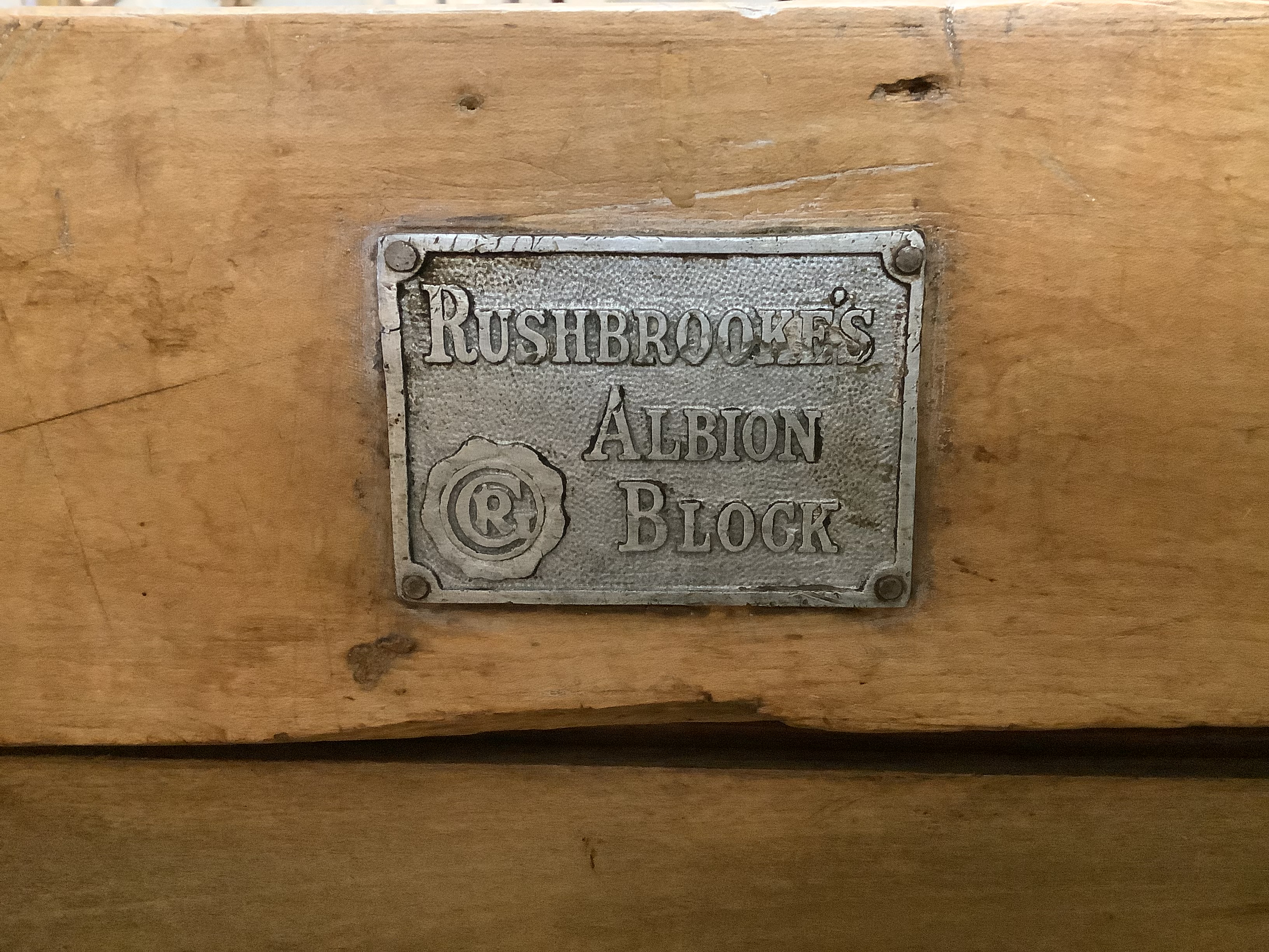 A 'Rushbrookes Albion' butcher's block on pine stand, width 60cm, depth 61cm, height 81cm